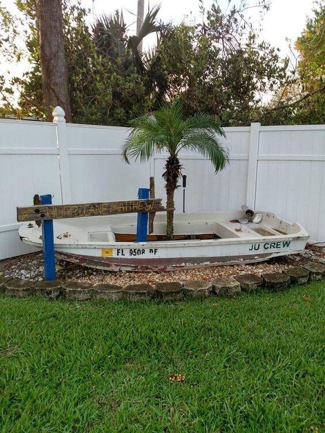 Weathered Boat Planter Overflowing Blooms