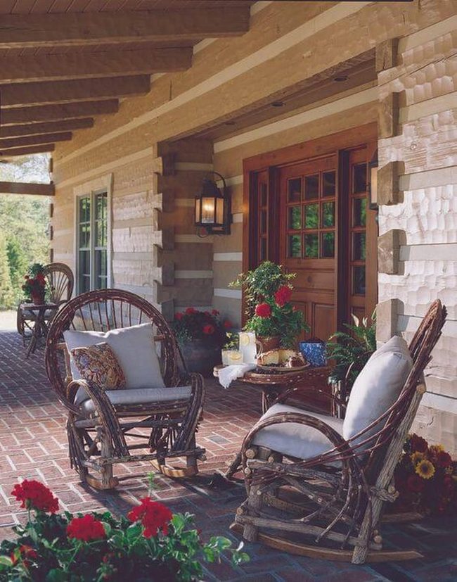 Wooden Porch With Blooming Potted Plants