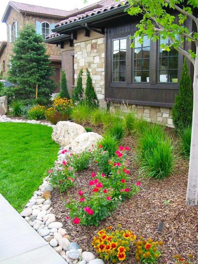 Swaying Grasses With River Rock Borders