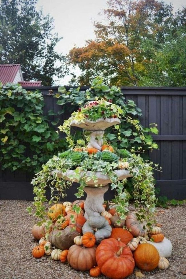 Ivy-Framed Fountain With Autumn Pumpkins