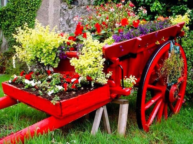 Red Cart Overflowing With Blooms