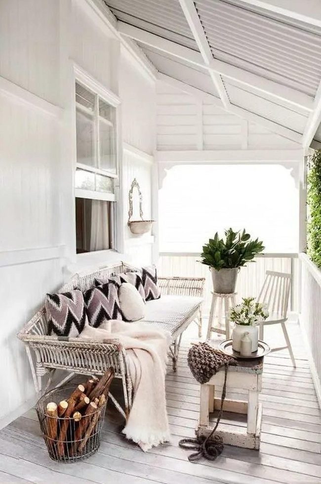 White Wood Patio With Wicker Seating