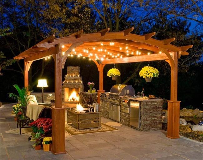 Stone Pergola Kitchen With Fireplace