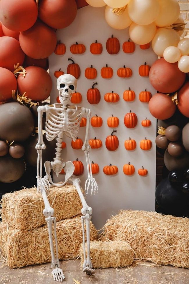 Skeleton Pumpkins On Golden Straw