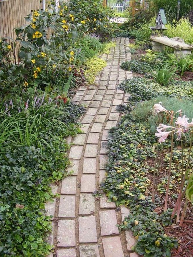 Brick Path Through Blooming Garden