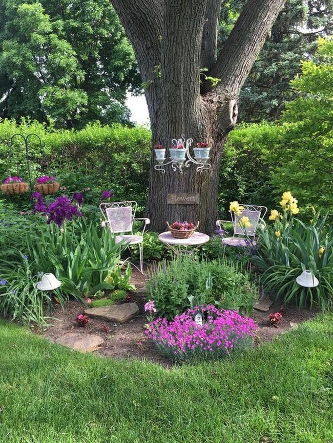 Flower-Framed Garden Seating With Evening Lights