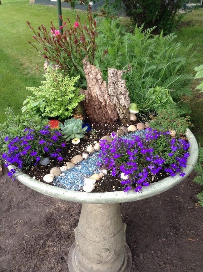 Purple Blooms In Repurposed Stone