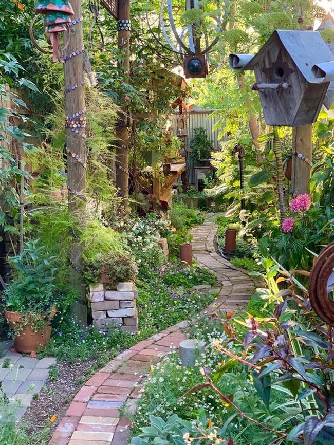 Brick Path Through Blooming Garden