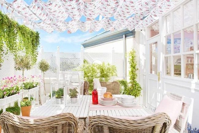 White Wicker Patio With Red Accents