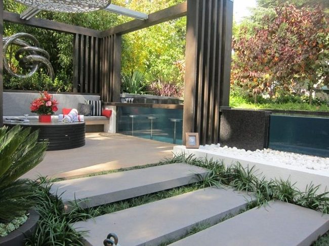 Natural Wood Pergolas Through Garden Pathways