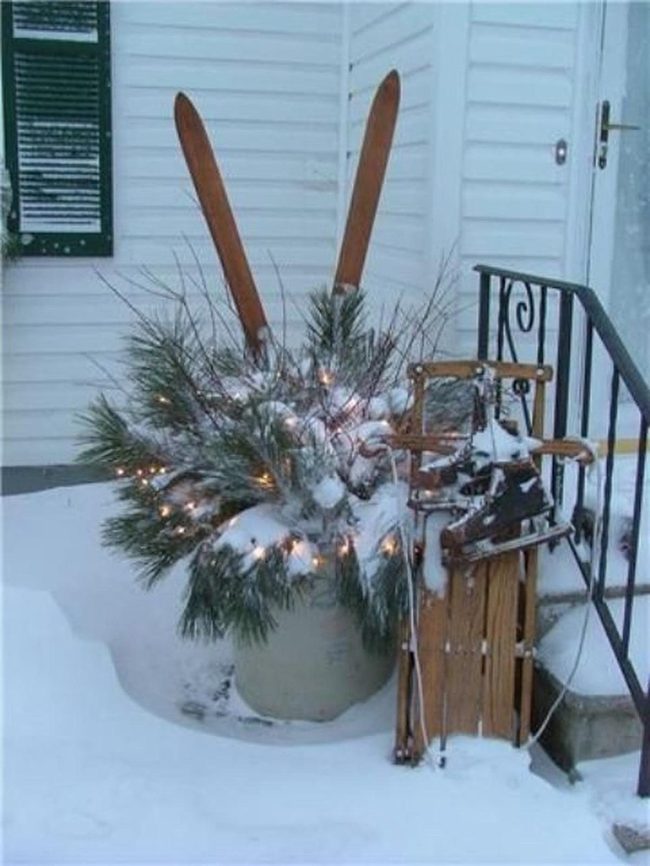 Vintage Wooden Sleds Against Black Railing