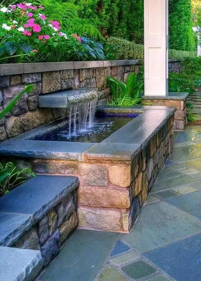 Pink Flowers In Stone Water Garden