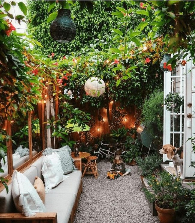 Peaceful Garden With Blue Cushioned Bench