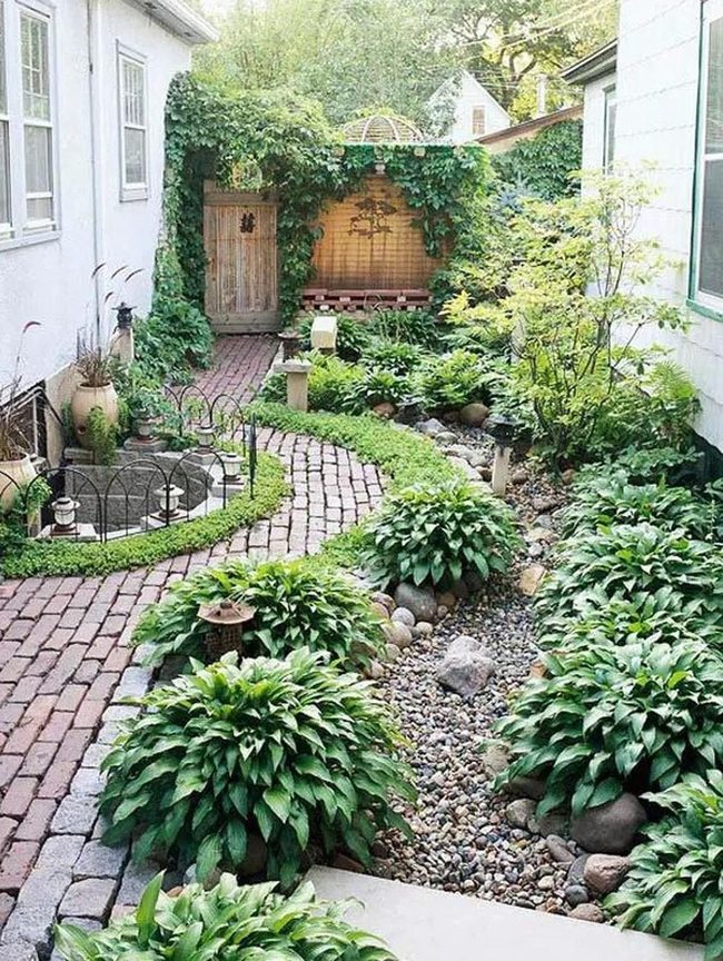 Brick Path Through Lush Garden