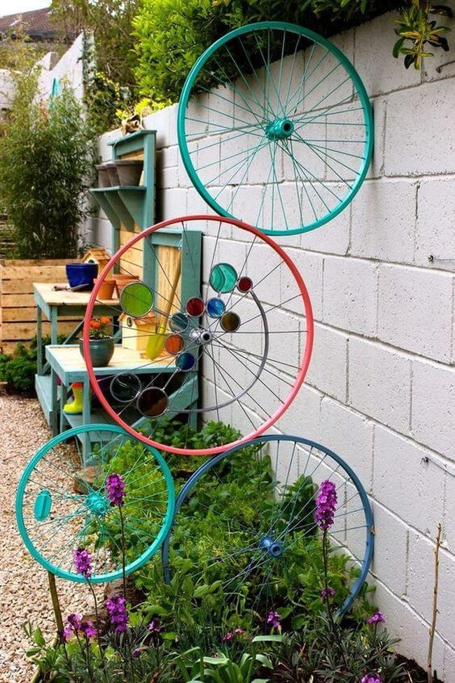Stacked Bicycle Wheels Among Blooms