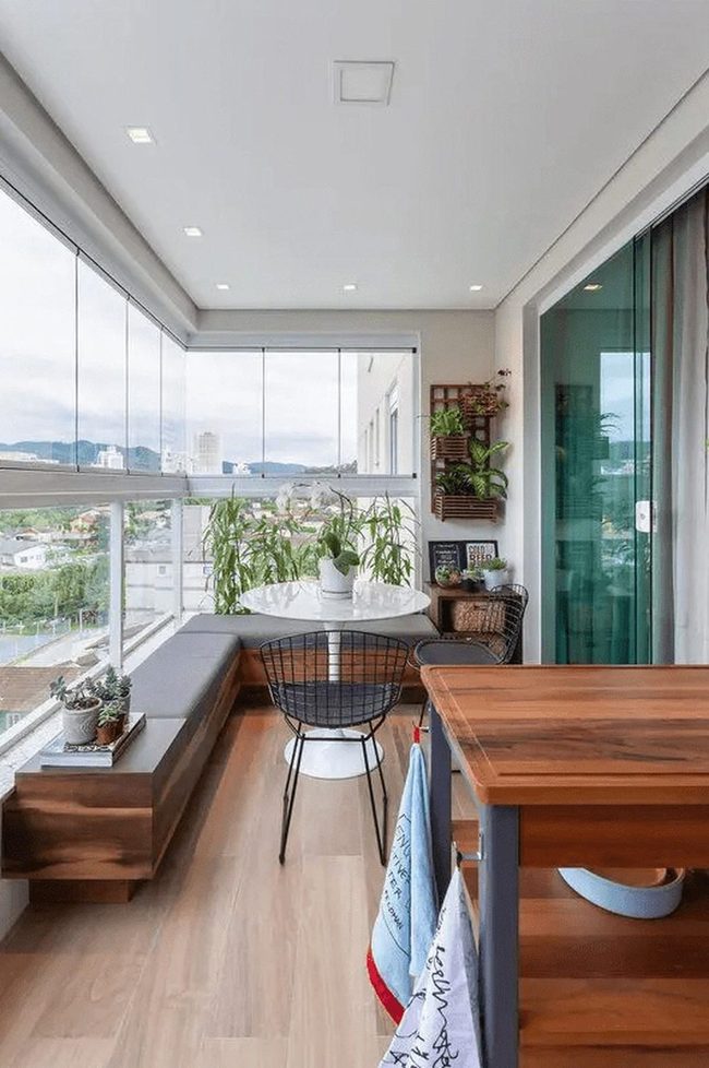 Wooden Balcony With Green Plants