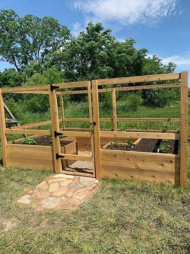 Raised Beds Behind Wooden Garden Gates