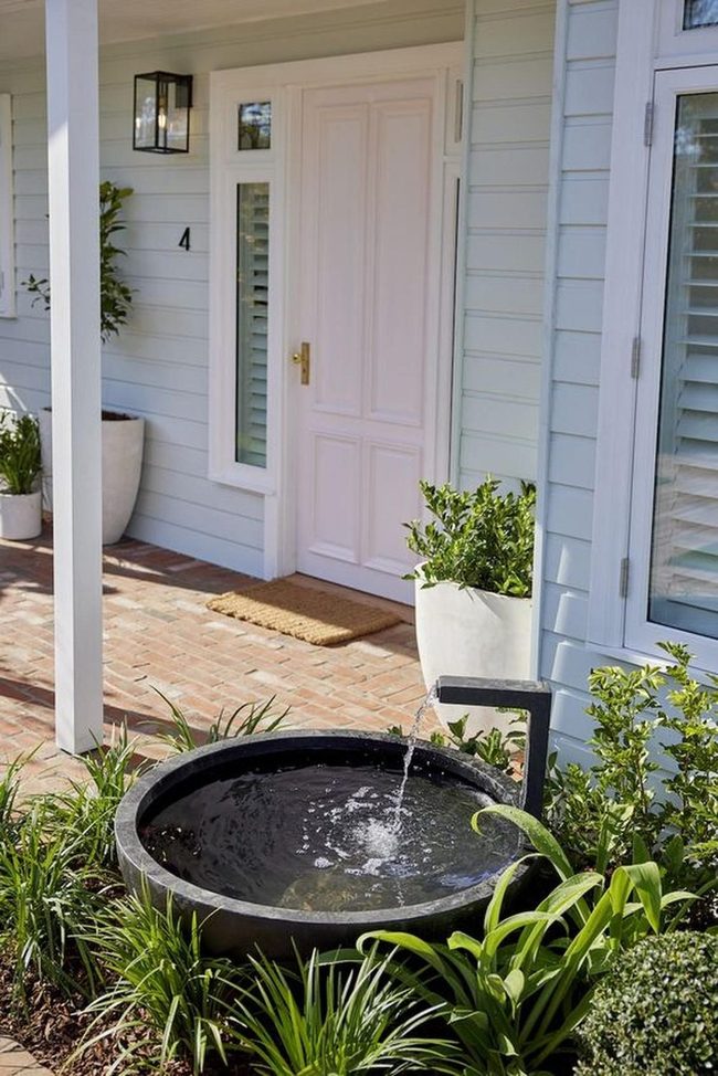 Light Blue Porch With Brick And Fountain
