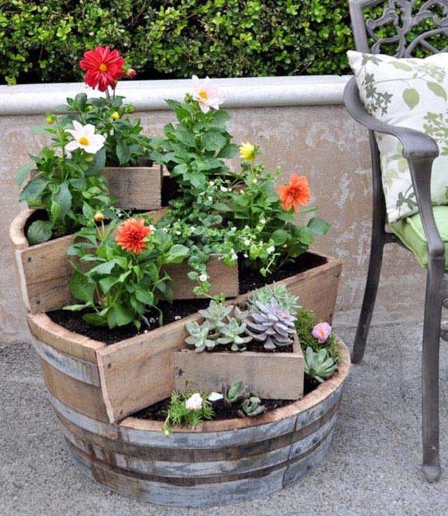 Stacked Barrels Spilling Colorful Flowers