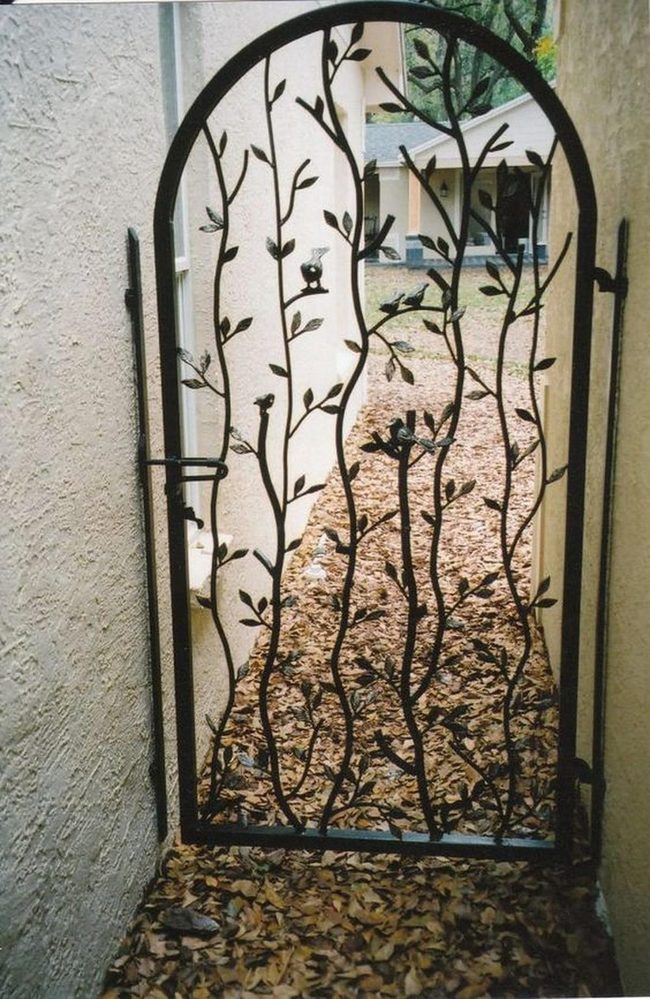 Ornate Bird Gates With Falling Leaves