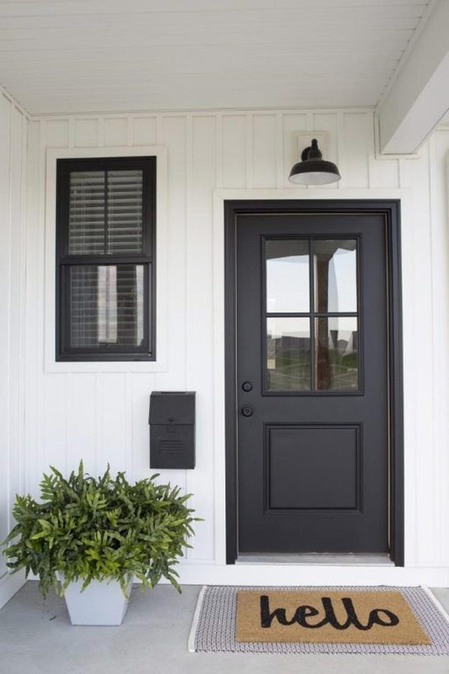 Black Door White Walls Green Plants