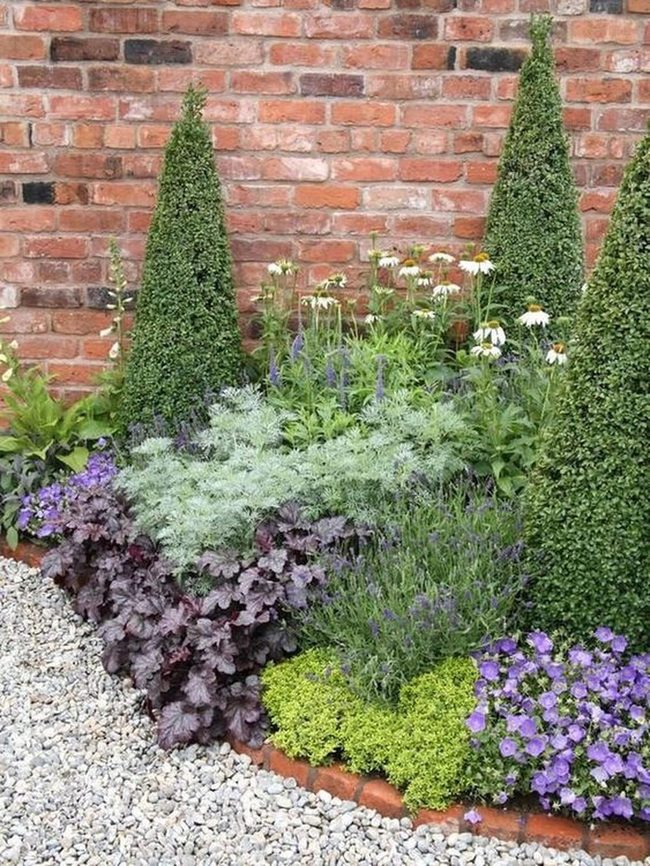 Brick Corner With Purple Blooms