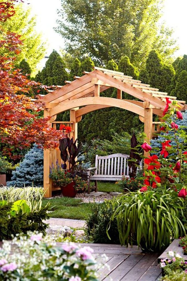 Wooden Pergolas Draped In Climbing Flowers