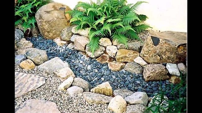Dark Water Through Stone And Green