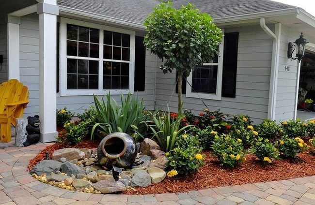 Red Mulch Garden With Stone Accents