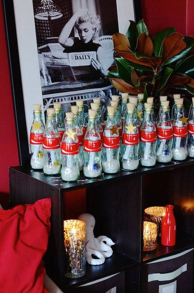 Vintage Coca-Cola Bottles In Garden Plants