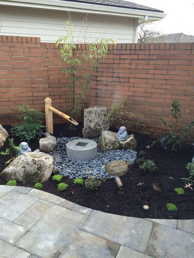 Stone Garden With Flowing Bamboo Water