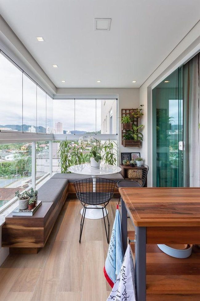 Light Wood Balcony With Green Plants