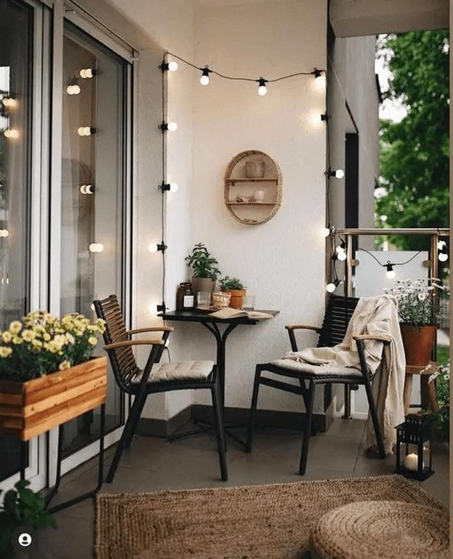 String Lights And Black Chairs Balcony