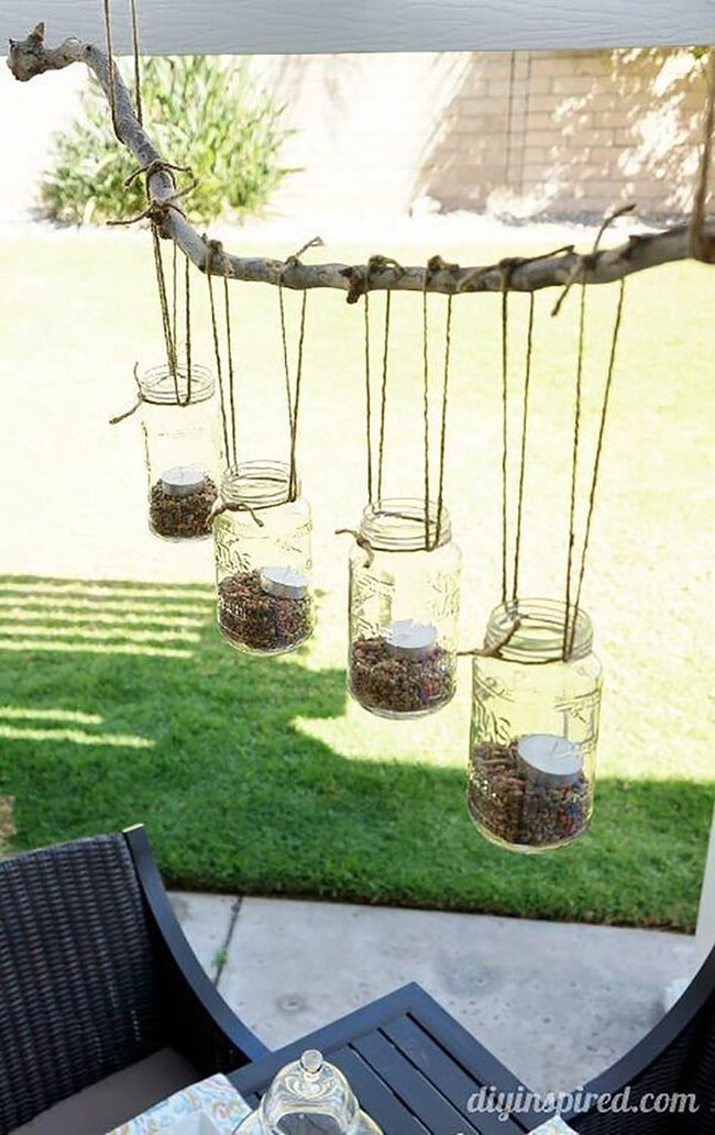 Glowing Mason Jars On Wooden Sticks