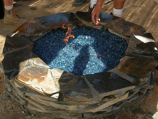 Stacked Stone Fire Pit With Blue Glass