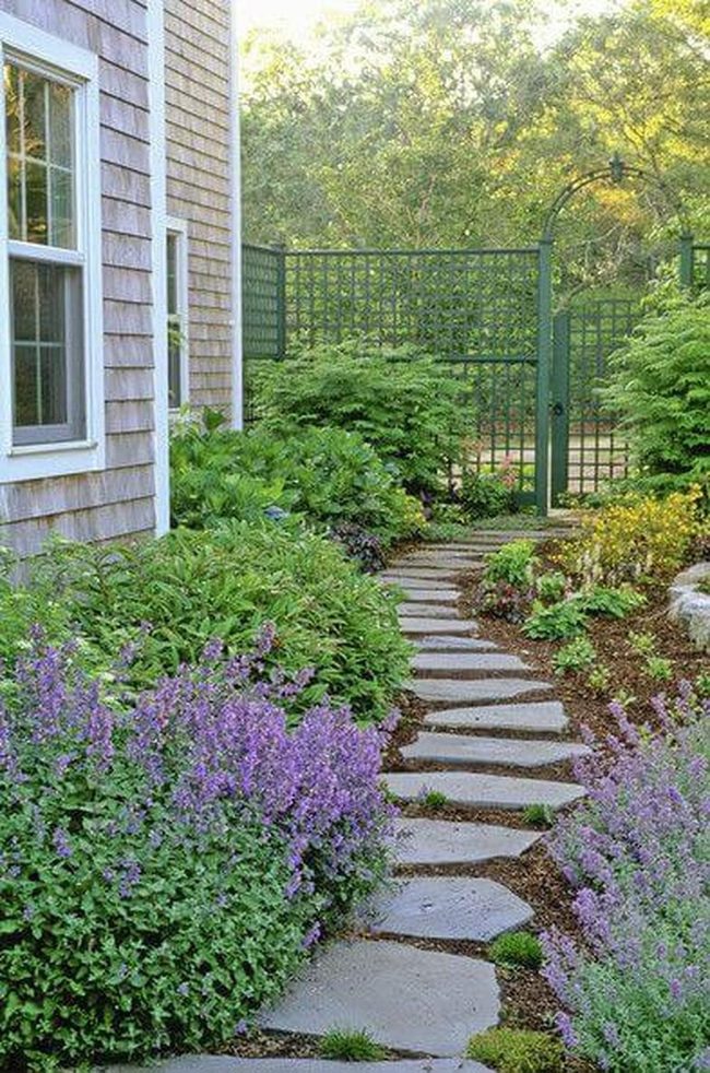 Purple Flowers Through Stone Gateway