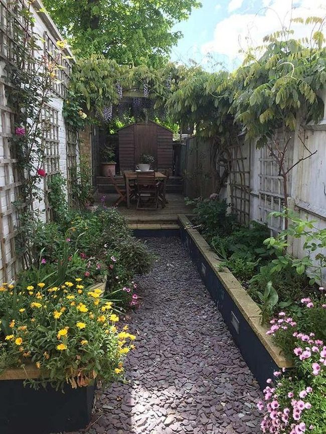 Stone Pathway Through Flowering Green Walls