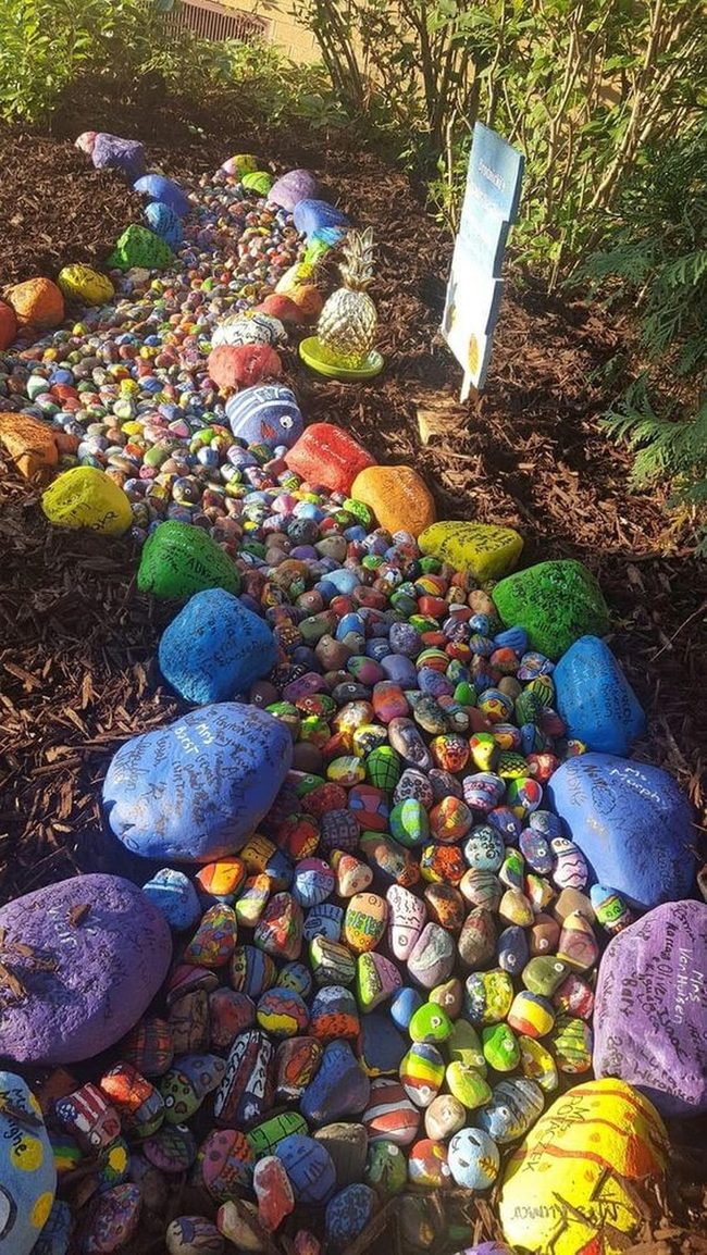 Painted Stones Flow Through Garden
