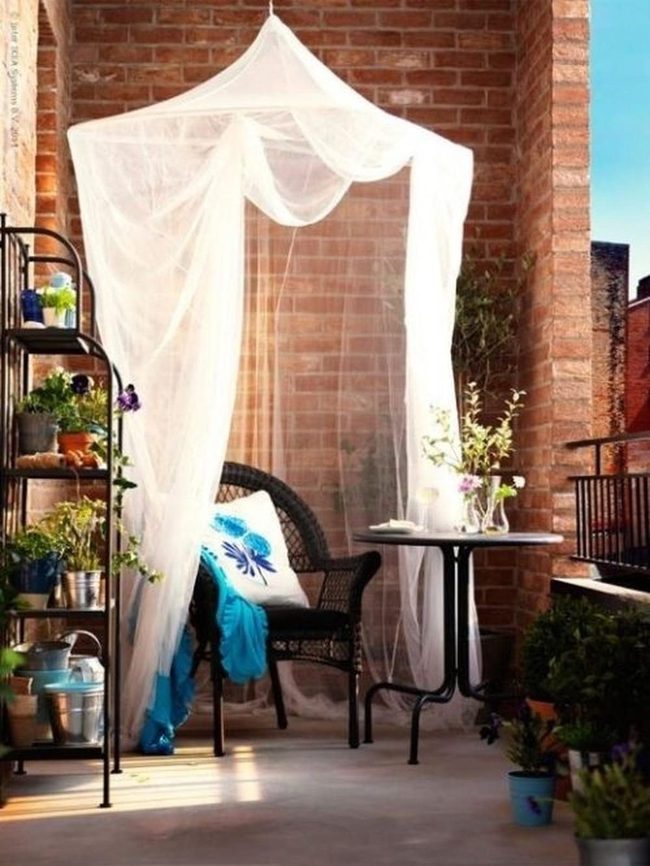 Red Brick Balcony With Blue Cushions