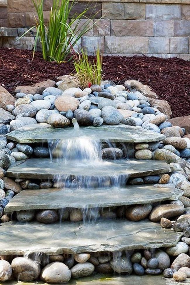 Cascading Stone Waterfall With Green Accents