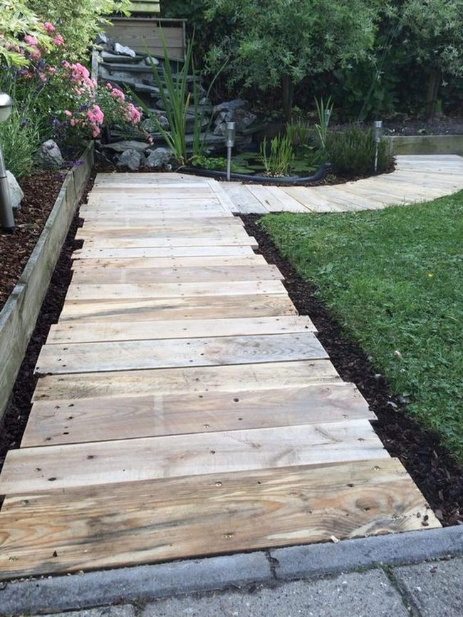 Wooden Path Through Blooming Garden