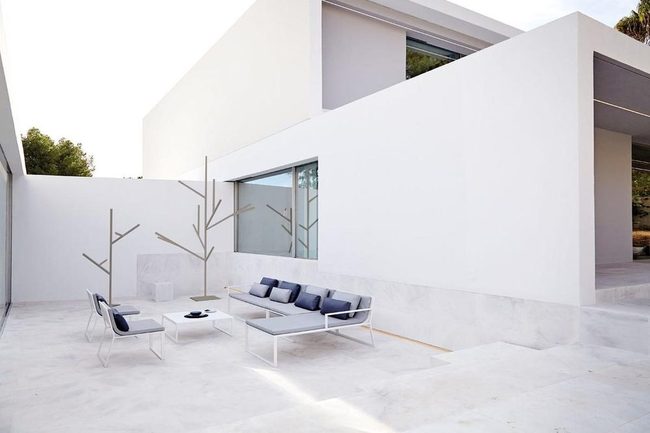 Dark Cushions Against White Minimalist Space
