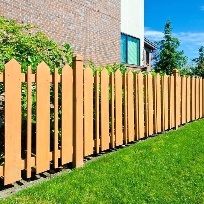 White Pickets Frame Green Lawns