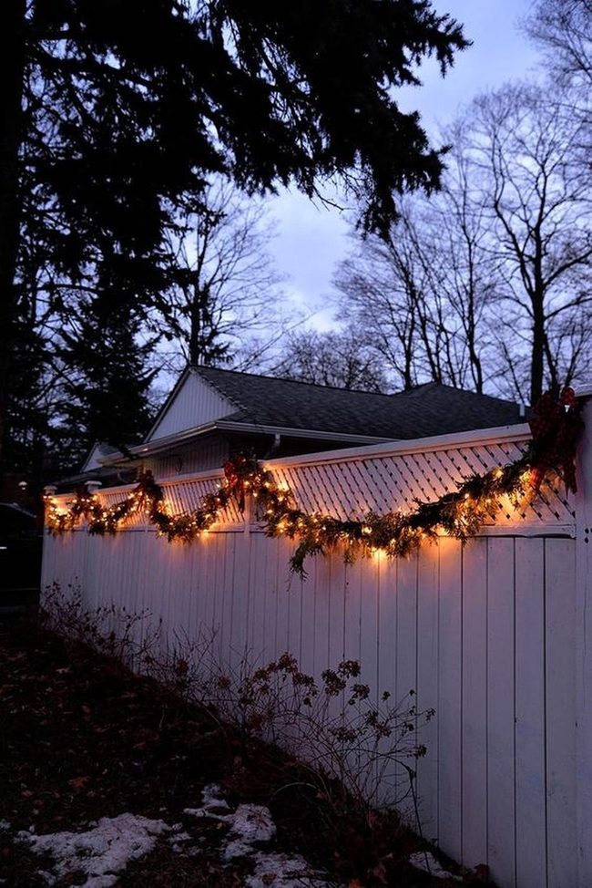 White Lights And Crimson Ribbons On Green Garland