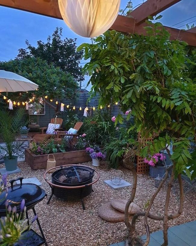 Firelit Backyard With Flowering Plants