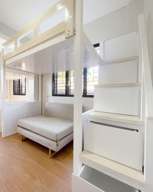 White Loft with Sofa and Stair Storage