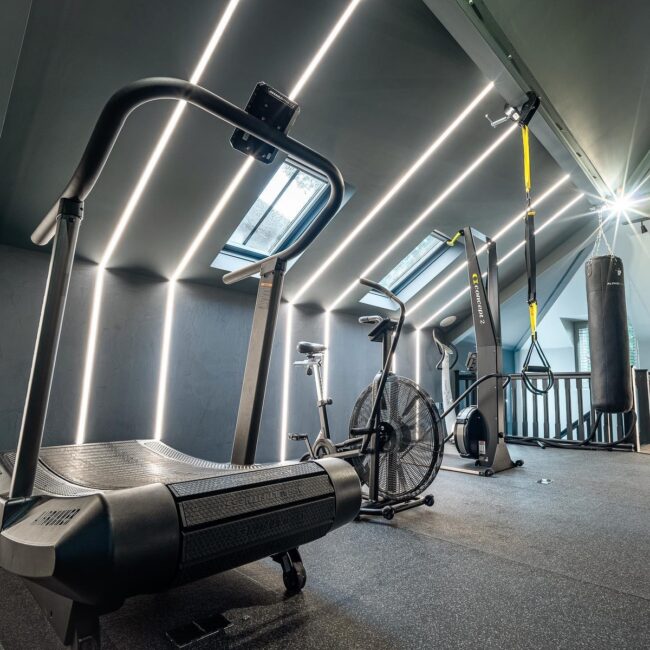 High-Tech Home Gym Featuring Interactive Lighting