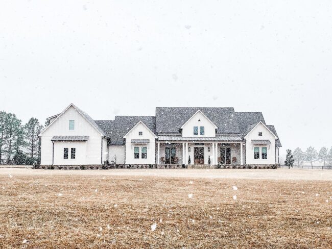 Elegant Snow-Covered Farmhouse