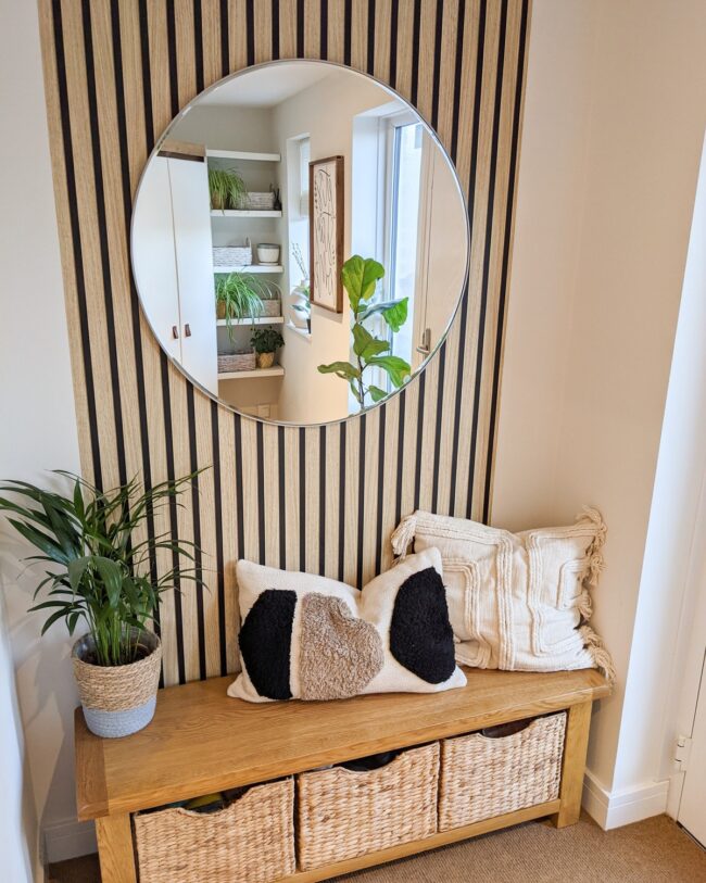 Chic Entryway Featuring Round Mirror